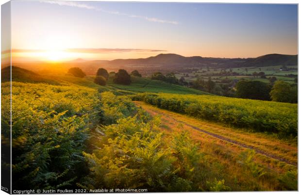 Sunrise over the Shropshire Hills Canvas Print by Justin Foulkes