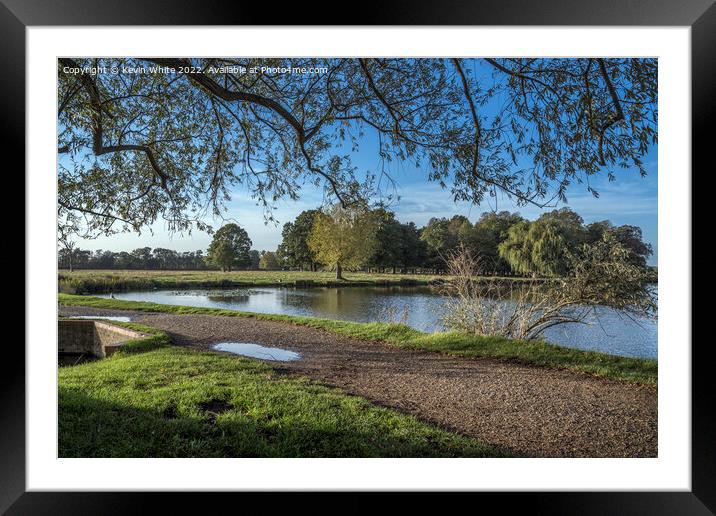 Footpath across the pond Framed Mounted Print by Kevin White