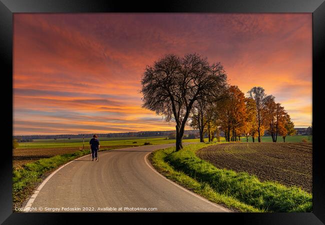 Sunset over rural road. Framed Print by Sergey Fedoskin