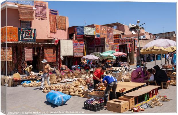 Market place in Marrakech, Morocco Canvas Print by Kevin Hellon
