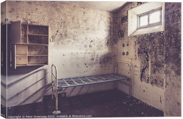 Metal Bedframe & Cupboard Storage In An Inmates Prison Cell In A Canvas Print by Peter Greenway