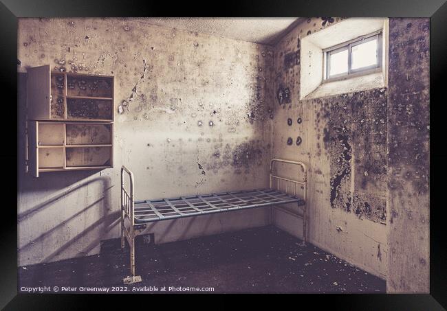 Metal Bedframe & Cupboard Storage In An Inmates Prison Cell In A Framed Print by Peter Greenway