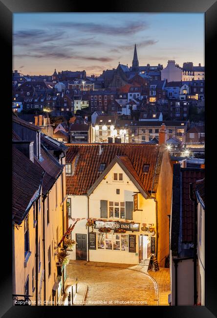 Across the roofs of Whitby Yorkshire twilight Framed Print by Chris Warren