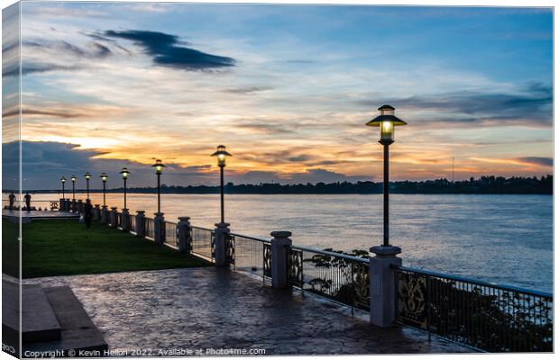 Sunset on the Mekhong river on the promenade in Nong Khai, Thail Canvas Print by Kevin Hellon