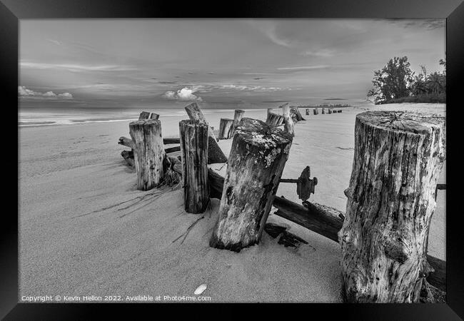 Posts in the sand Framed Print by Kevin Hellon