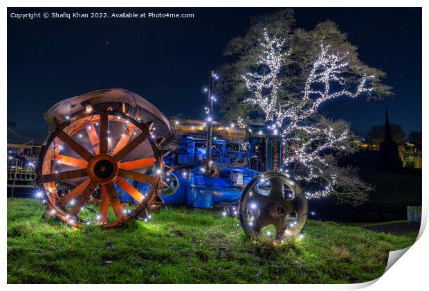Tractor & Tree covered in Christmas fairy lights Print by Shafiq Khan