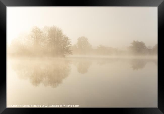 Foggy early morning on a lake. Framed Print by Sergey Fedoskin