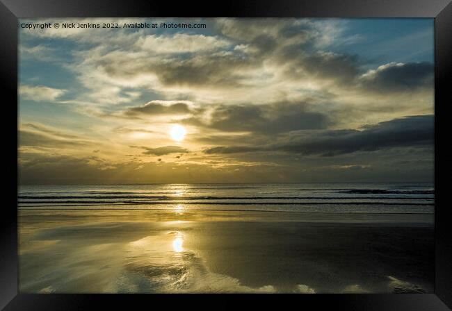 The Setting Sun over the Beach and Coastline of Du Framed Print by Nick Jenkins