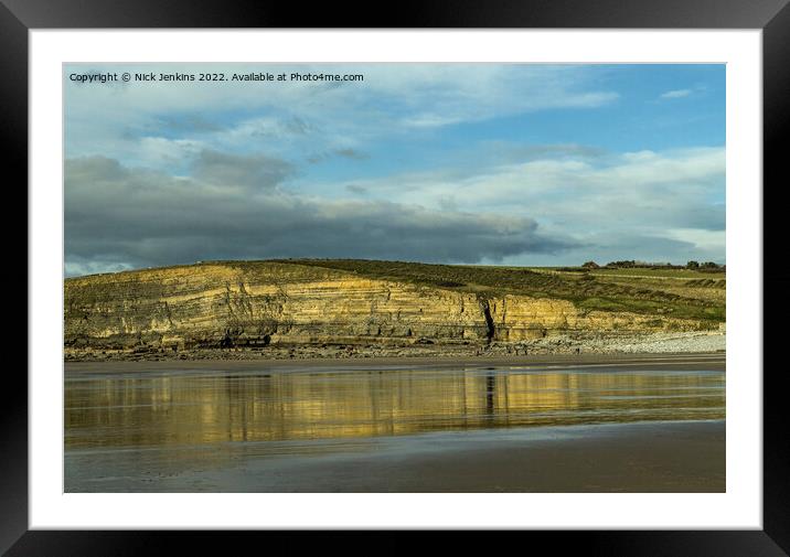 Dunraven Bay cliffs reflected in wet sand Framed Mounted Print by Nick Jenkins
