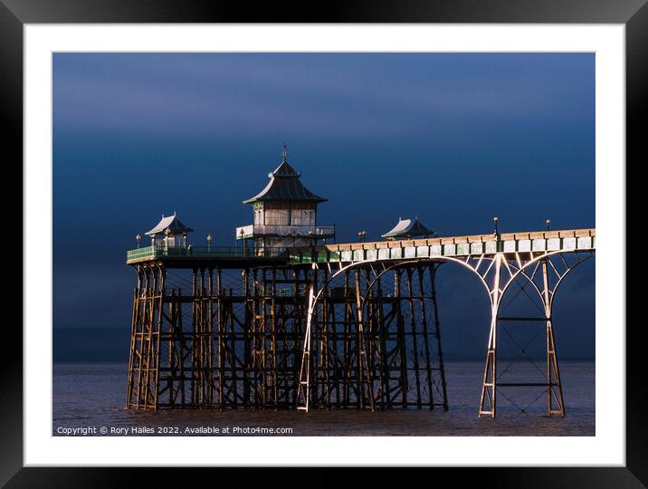 Clevedon Pier. at low tide with moody sky Framed Mounted Print by Rory Hailes
