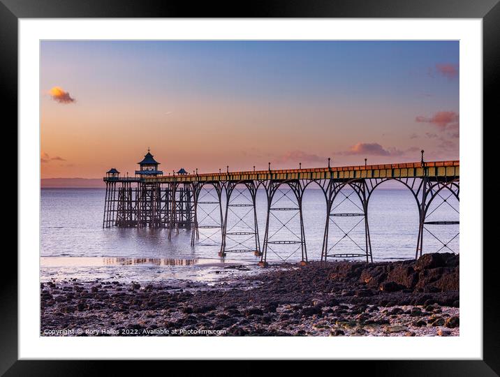 Clevedon Pier at sunset and low tide Framed Mounted Print by Rory Hailes