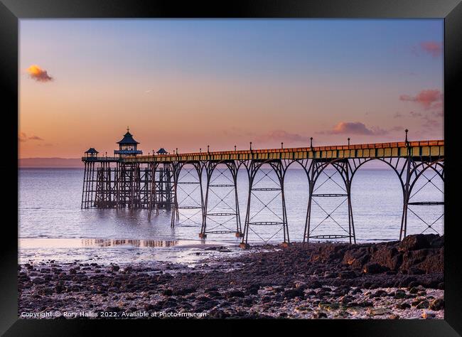 Clevedon Pier at sunset and low tide Framed Print by Rory Hailes