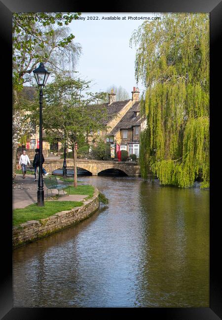 By the river in Bourton-on-the-Water Framed Print by Christopher Keeley