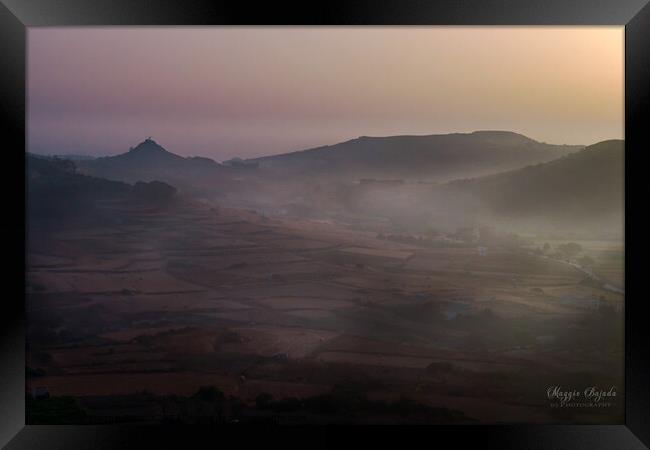 Early morning sunrise with mist all over the fields in Gozo, Malta.  Framed Print by Maggie Bajada