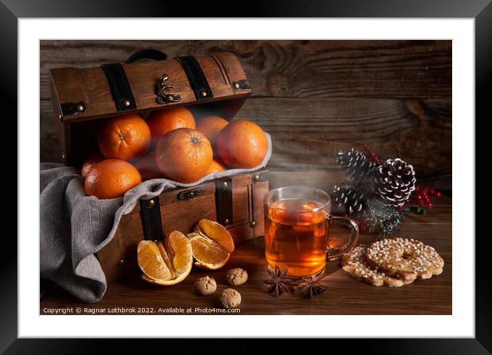 Hot tea and oranges in a wooden chest Framed Mounted Print by Ragnar Lothbrok