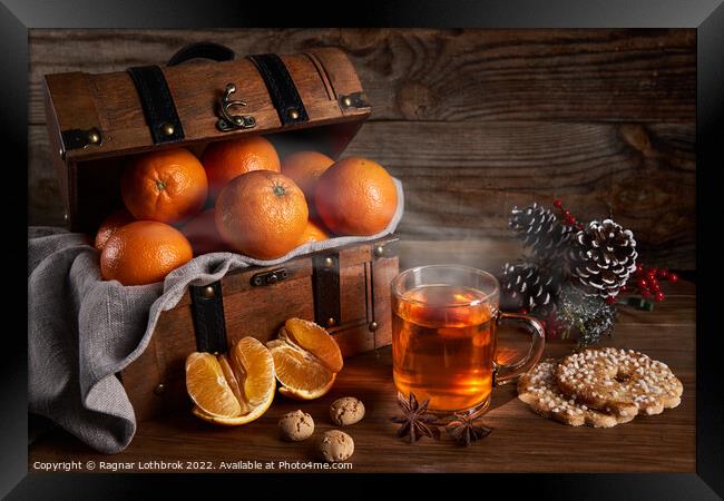 Hot tea and oranges in a wooden chest Framed Print by Ragnar Lothbrok
