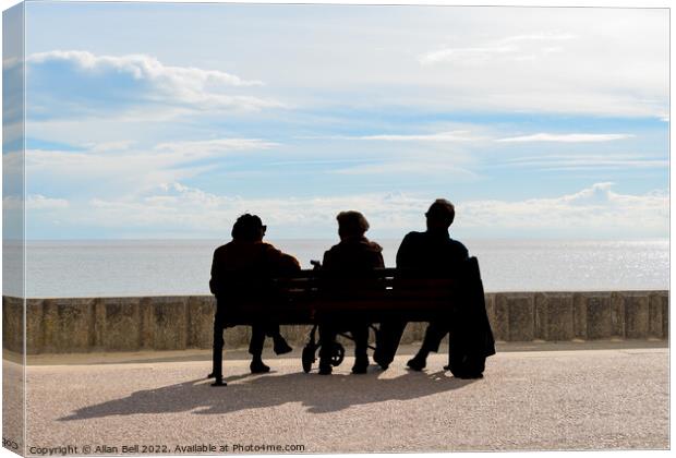 Three peoplepeople sitting on a bench looking out  Canvas Print by Allan Bell