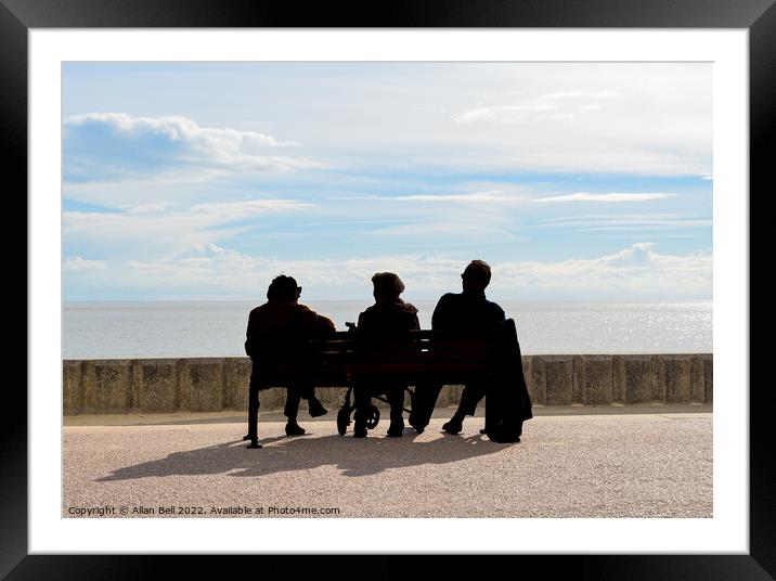 Three peoplepeople sitting on a bench looking out  Framed Mounted Print by Allan Bell