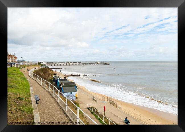 Southwold seafront view of beach huts and pier  Framed Print by Allan Bell