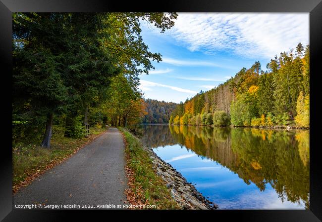 Road along the Vltava river in the autumn season. Framed Print by Sergey Fedoskin