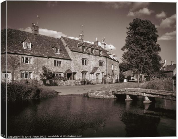 Lower Slaughter riverside cottages Canvas Print by Chris Rose