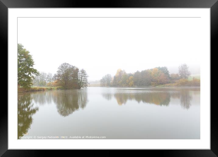 Foggy morning on the lake. Autumn landscape. Framed Mounted Print by Sergey Fedoskin