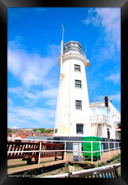 Harbour entrance lighthouse Scarborough. Framed Print by john hill