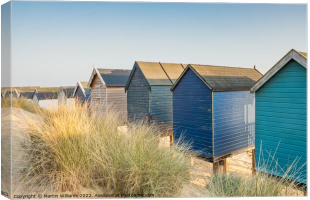 Beach huts at Wells-Next-the-Sea Canvas Print by Martin Williams