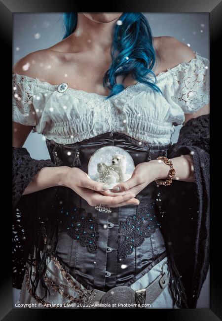 Woman Holding Snowglobe Framed Print by Amanda Elwell