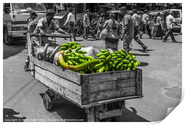 Man pushing crt of bananas in Colombo, Sri Lanka Print by Kevin Hellon