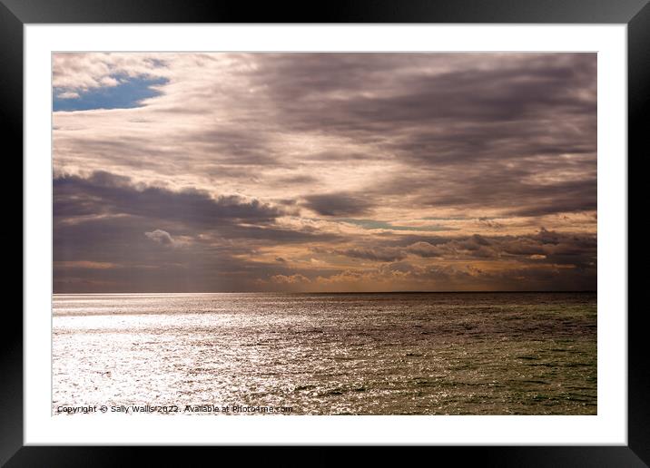 Calm water, threatening sky Framed Mounted Print by Sally Wallis