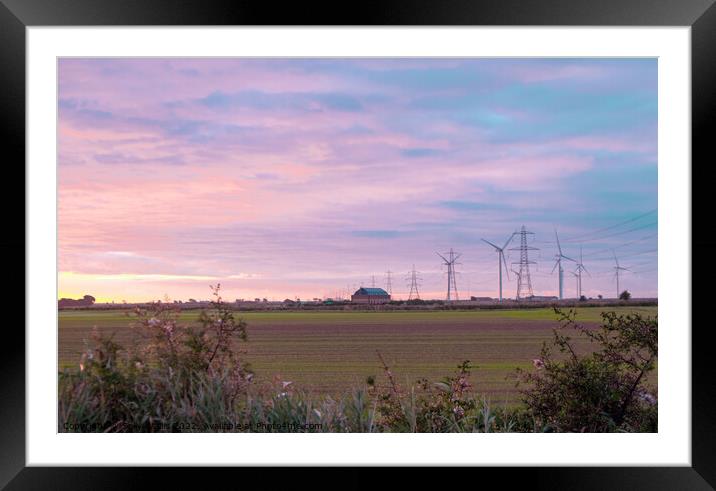 Pylons and wind turbines at daybreak Framed Mounted Print by Sally Wallis