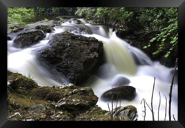 Flowing fast Framed Print by Paul Messenger