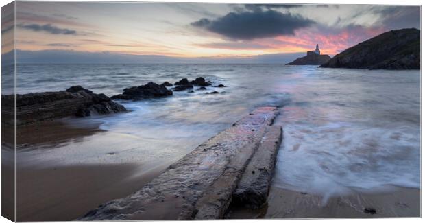 Sunrise over Mumbles lighthouse Canvas Print by Leighton Collins