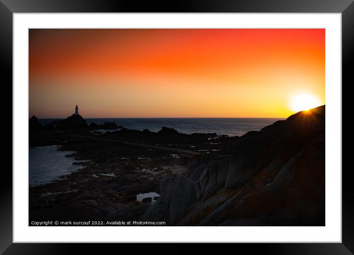 A sunset over a body of water Framed Mounted Print by mark surcouf