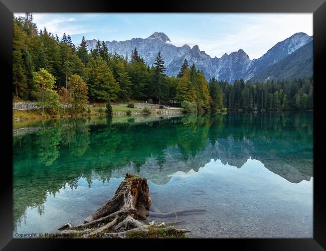 Picturesque Blue Lake Fusine with Julian Alps in Background. Framed Print by Maggie Bajada