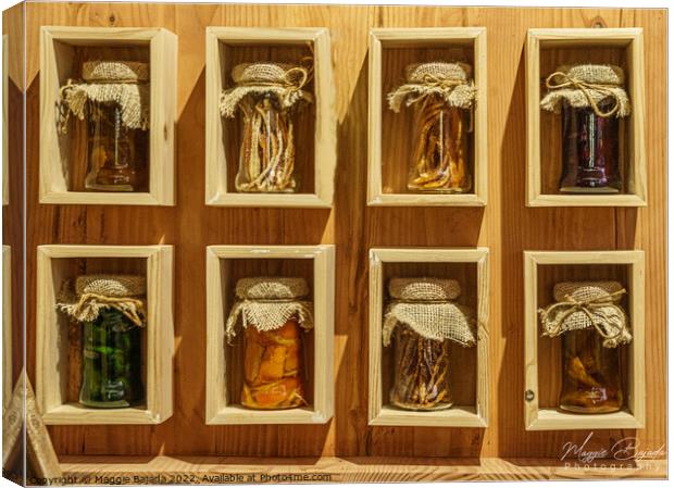 Display of Pickled Jars on a wooden shelves. Canvas Print by Maggie Bajada