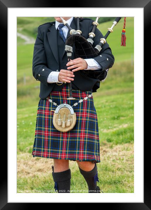 Scottish bagpiper in traditional kilt in the Highl Framed Mounted Print by Delphimages Art