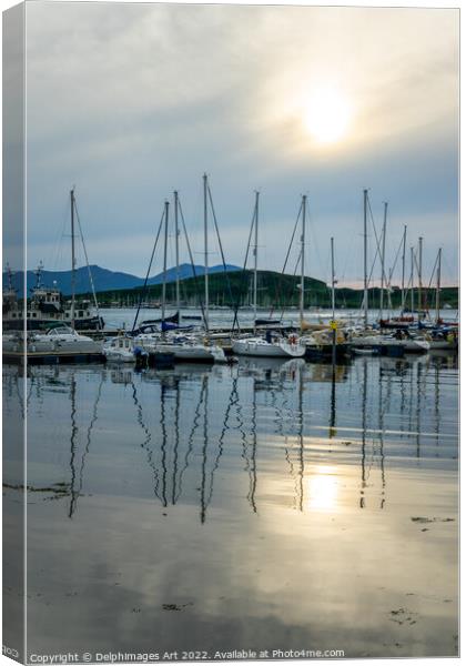 Boats reflection in the harbor of Oban Canvas Print by Delphimages Art