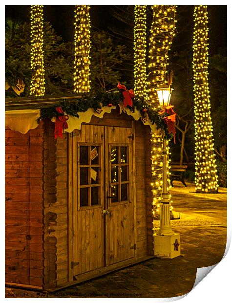 Christmas Hut with Night lights Decorations. Print by Maggie Bajada