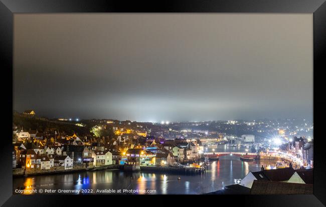 Whitby Harbour Illuminated At Night Framed Print by Peter Greenway