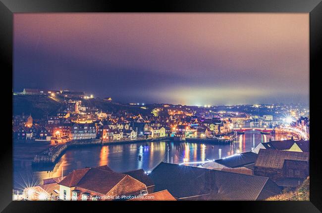 Whitby Harbour Illuminated At Night Framed Print by Peter Greenway