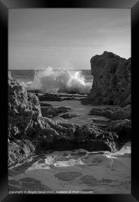 Wave Crushing Rocks in Gale Beach Framed Print by Angelo DeVal