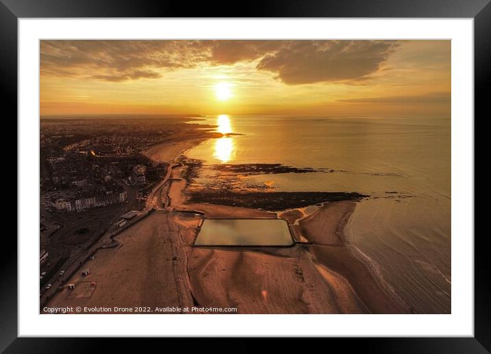A sunset over a body of water Framed Mounted Print by Evolution Drone