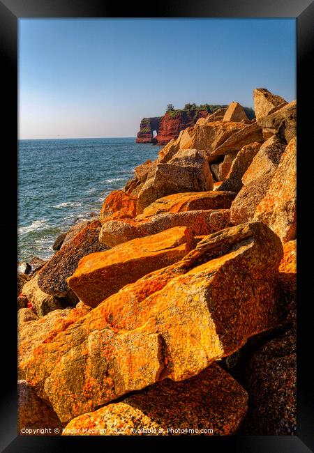 Radiant Sunset over Lichen-Covered Rocks Framed Print by Roger Mechan