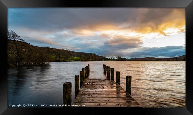 Coniston jetty at sunset Framed Print by Cliff Kinch