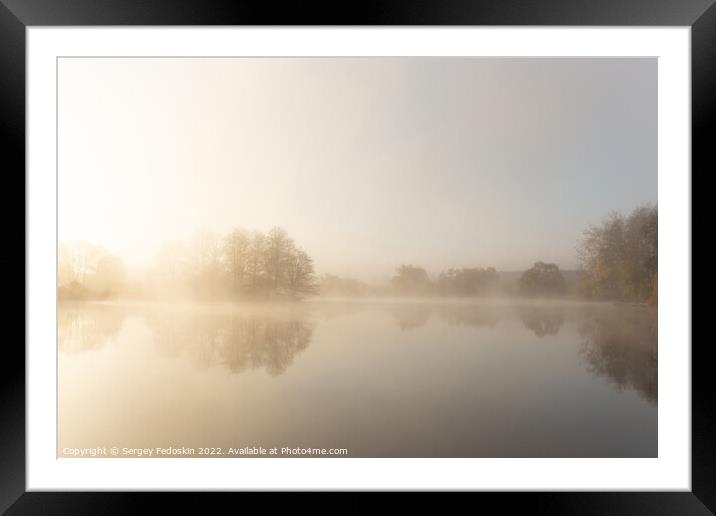 Foggy early morning on a lake. Framed Mounted Print by Sergey Fedoskin