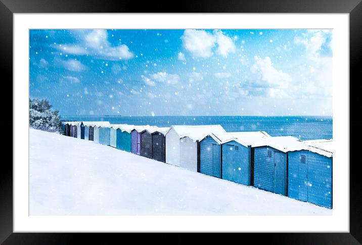 Beach huts in the snow at Frinton on Sea Framed Mounted Print by Paula Tracy