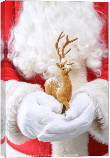 Santa Holding Reindeer Figure Canvas Print by Amanda Elwell