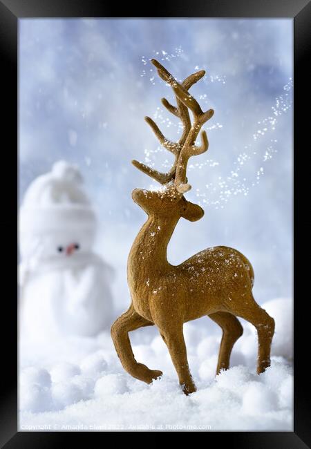 Reindeer In Snow Framed Print by Amanda Elwell